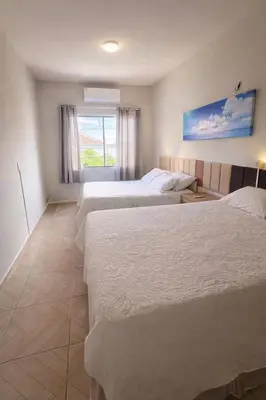 Uma cama ou camas num quarto em Apartamento completo Excelente localização Centro