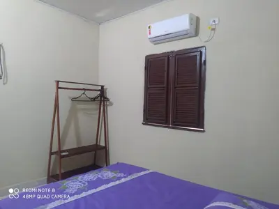 Uma cama ou camas num quarto em Beach house icaraizinho