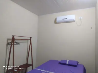 Uma cama ou camas num quarto em Beach house icaraizinho