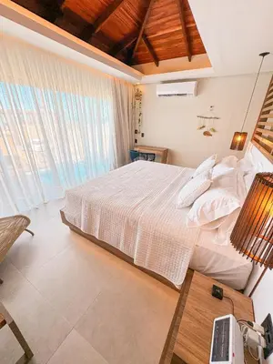 Uma cama ou camas num quarto em Poozendin Hotel de Charme
