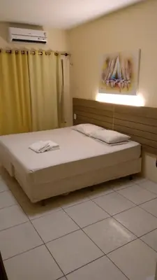 Uma cama ou camas num quarto em Flat na Praia de Iracema 105
