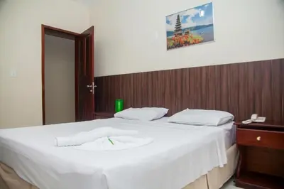 Uma cama ou camas num quarto em Hotel Netuno Beach