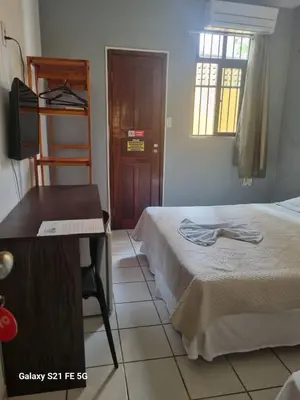 Uma cama ou camas num quarto em Hotel Netuno Beach