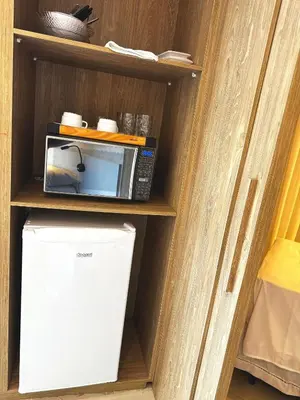 A cozinha ou kitchenette de Deluxe Rooms by Holiday Stays