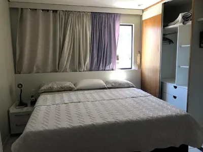 Uma cama ou camas num quarto em Homestay Fortaleza