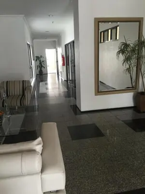 Uma área de estar em Homestay Fortaleza