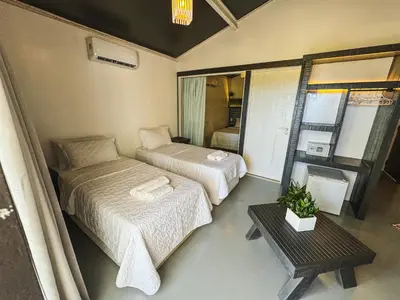 Uma cama ou camas num quarto em CHICO DINA POUSADA