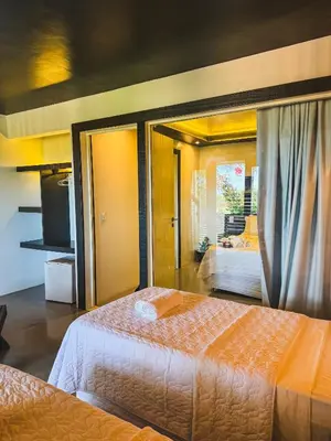 Uma cama ou camas num quarto em CHICO DINA POUSADA