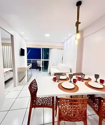 Uma televisão e/ou sistema de entretenimento em Apartamento em Beach Class Praia de Iracema Por CasAmarInn