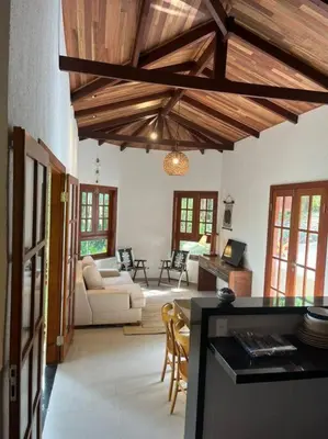 Uma cama ou camas num quarto em Chalé Carolina Bela