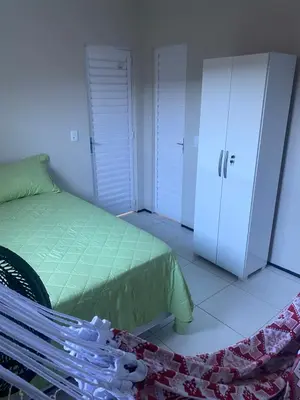 Uma cama ou camas num quarto em Portas do Morro Branco