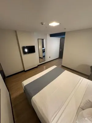 Uma cama ou camas num quarto em WA HOTEL FORTALEZA