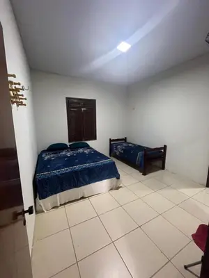 Uma cama ou camas num quarto em Casa Sítio Beija Flor