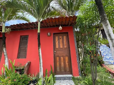 Um jardim no exterior de Pousada Villa Flamboyant