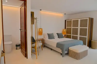 Uma cama ou camas num quarto em Condominio de Villa com quartos ou villas en aluguel : Kite Villas - 3 villas (Cajueiro, Carnauba e Beija Flor)
