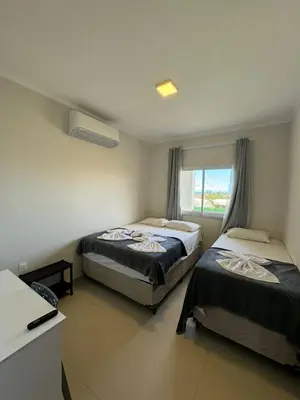 Uma cama ou camas num quarto em Flat Canoa Quebrada com Terraço