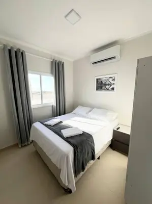Uma cama ou camas num quarto em Flat Canoa Quebrada com Terraço