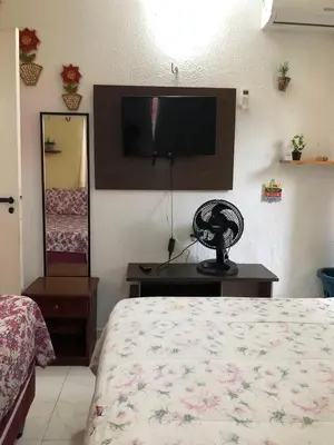 Uma televisão e/ou sistema de entretenimento em Apartmento Aquiraz - Crystal Park Flat