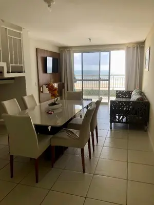 Uma área de estar em Apartamento Vista total do Mar uma cobertura a 400m do Beach Park no Porto das Dunas Aquiraz Condomínio Terramaris Piscina ampla Parque infantil Sauna Estacionamento privado