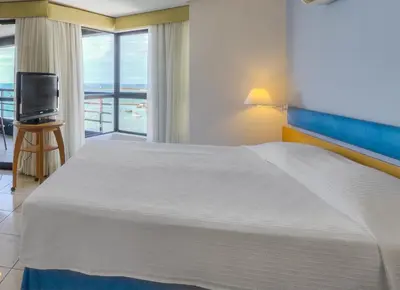 Uma cama ou camas num quarto em Iate Plaza Hotel