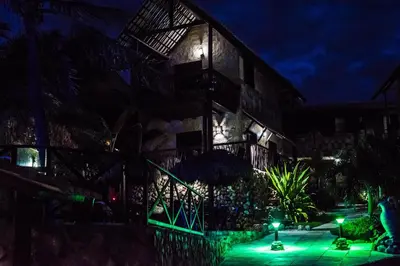 Um jardim no exterior de Pousada Mundial
