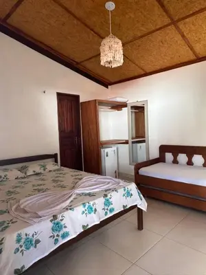 Uma cama ou camas num quarto em Flechimar Suítes