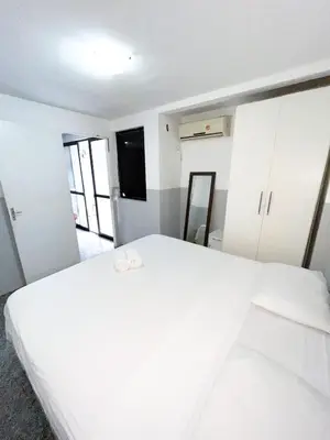 Uma cama ou camas num quarto em flat 202 Atlantico residence