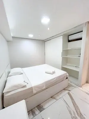 Uma cama ou camas num quarto em Flat atlantico 1301