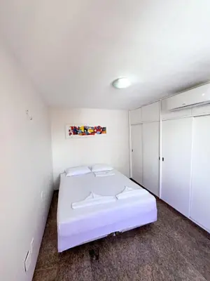 Uma cama ou camas num quarto em Flat atlantico 1601