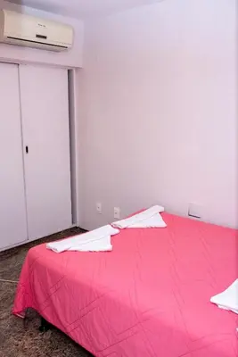 Uma cama ou camas num quarto em Flat atlantico 1601
