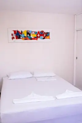 Uma cama ou camas num quarto em Flat atlantico 1601