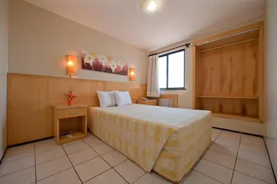 Uma cama ou camas num quarto em Iracema Travel