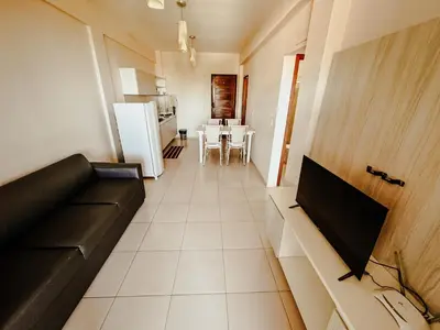 Uma televisão e/ou sistema de entretenimento em Kitecabana Apartamento