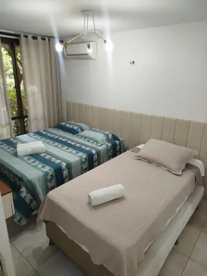 Uma cama ou camas num quarto em Wai Wai Cumbuco Eco Residence