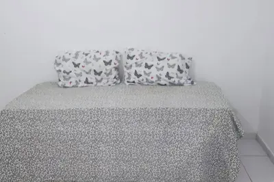 Uma cama ou camas num quarto em Hospedagem na Praia de Tibau - RN