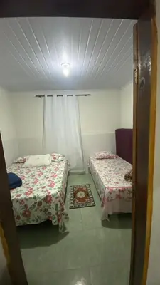 Uma cama ou camas num quarto em Casinha no Sítio