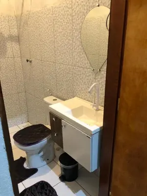 Uma casa de banho em Casinha no Sítio