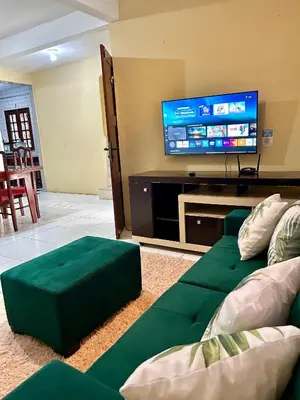 Uma televisão e/ou sistema de entretenimento em Casa Brisa da Praia em Paracuru