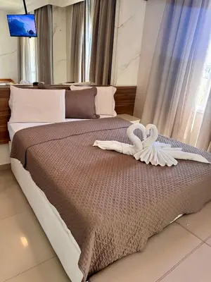 Uma cama ou camas num quarto em VG FUN Praia do Futuro Pé na Areia ap 311 IMOB TEMPORADA