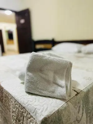 Uma cama ou camas num quarto em Pousada Navegantes Beach