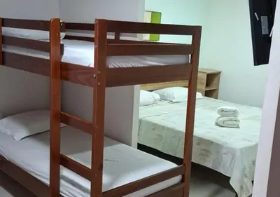 Uma cama ou camas num quarto em Pousada Navegantes Beach