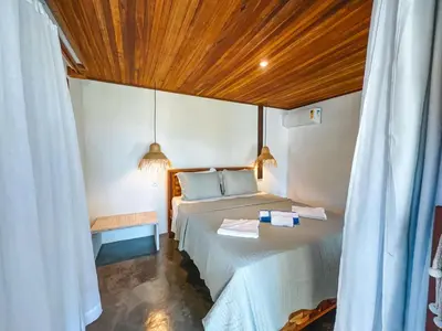 Uma cama ou camas num quarto em Pousada Dunnas Moitas