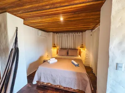 Uma cama ou camas num quarto em Pousada Dunnas Moitas