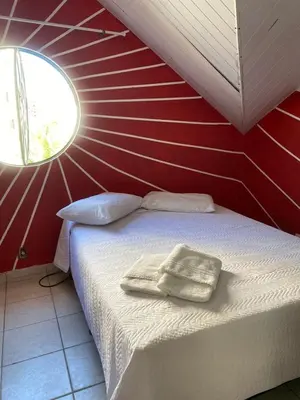Uma cama ou camas num quarto em pousada longarinas