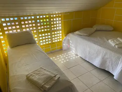 Uma cama ou camas num quarto em pousada longarinas