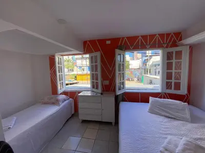 Uma cama ou camas num quarto em pousada longarinas