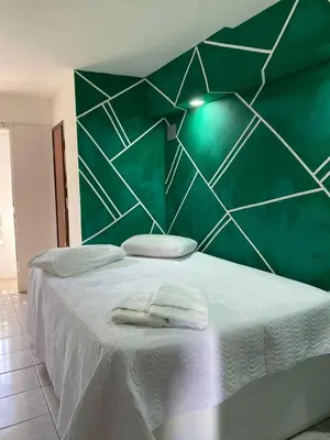 Uma cama ou camas num quarto em pousada longarinas
