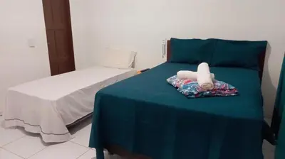 Uma cama ou camas num quarto em Pousada Vela dos Ventos