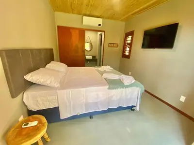 Uma cama ou camas num quarto em Casa do Pier, bangalôs em Fortim c/ Café da Manhã