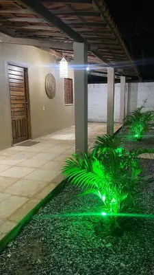 Um jardim no exterior de Casa em Praia de Flecheiras